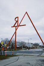 march 11, 2023: a giant red sculpture that appears to say 'RAT.'